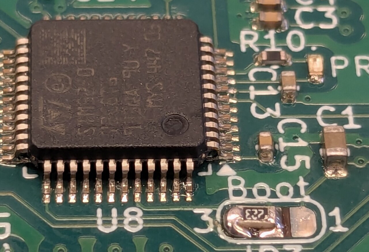 Close-up of an embedded electronics board with component labeling.