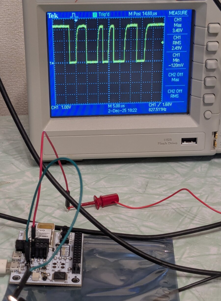 Oscilloscope and embedded hardware on a workbench.